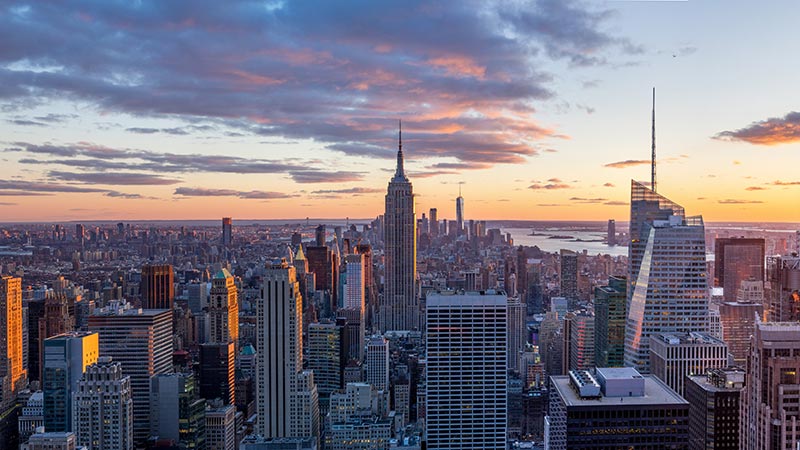 Amazing panorama view of  New York city skyline and skyscraper at sunset. Beautiful night view in Midtown Manhatton.